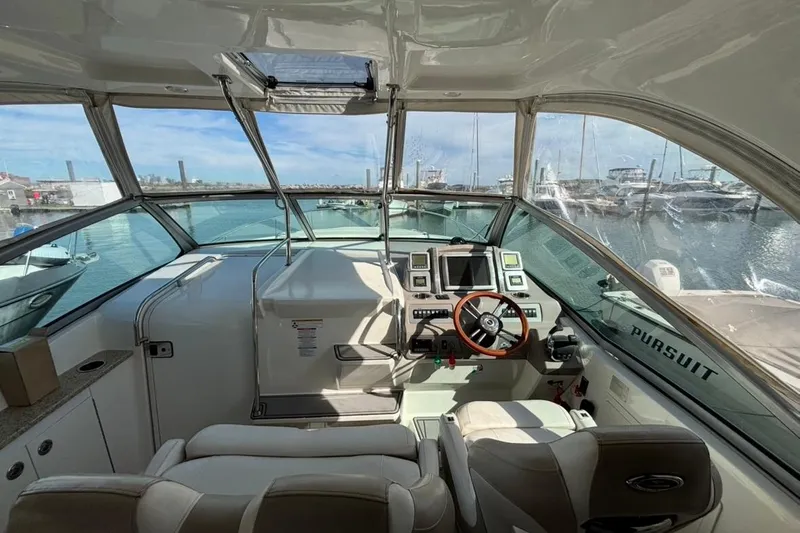 Slide: The Image of Interior view of 2011 CHAPPARELL Signature 330 boat cockpit with steering wheel and controls. - 10