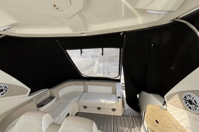 Slide: The Image of 2011 CHAPPARELL Signature 330 boat interior with seating and black curtains. - 14
