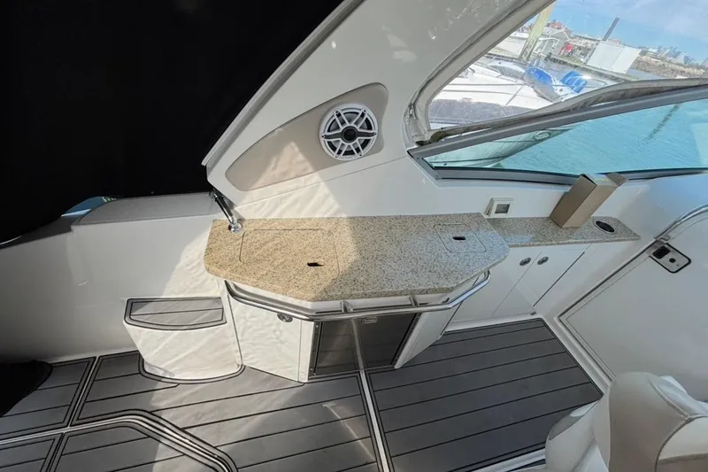 Slide: The Image of 2011 CHAPPARELL Signature 330 boat interior with granite countertop and sleek cabinetry. - 15
