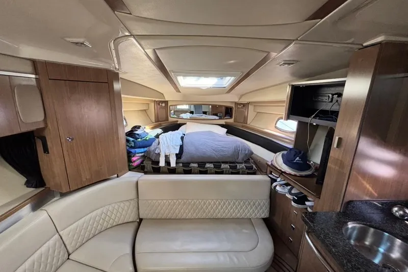 Slide: The Image of 2011 CHAPPARELL Signature 330 cabin interior with bed, seating, and storage. - 17