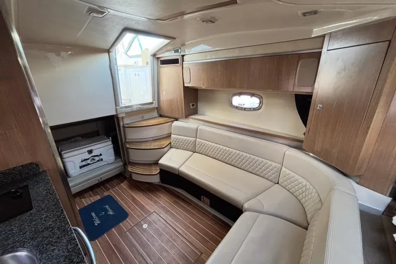 Slide: The Image of Luxurious interior of 2011 CHAPPARELL Signature 330 boat with elegant seating and wood finish. - 18