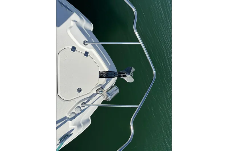 Slide: The Image of Bow of 2011 CHAPPARELL Signature 330 boat with stainless steel railing over water. - 28