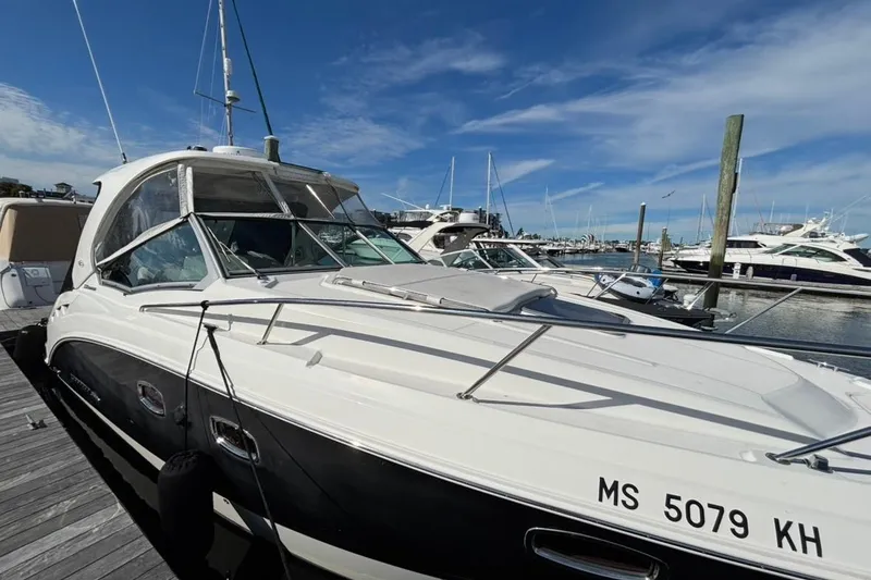 Slide: The Image of 2011 CHAPPARELL Signature 330 boat docked at marina under clear blue sky. - 3