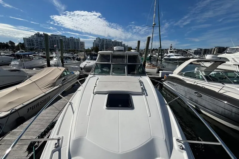 Slide: The Image of 2011 CHAPPARELL Signature 330 docked at marina, surrounded by other boats. - 5