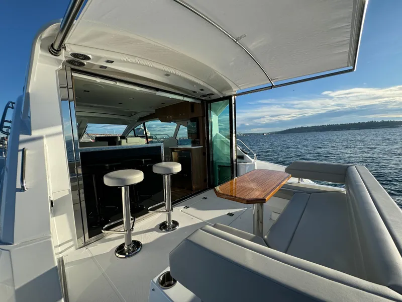 Slide: The Image of 2024 Cruisers Yachts 50 Cantius luxury yacht with open deck and ocean view. - 11