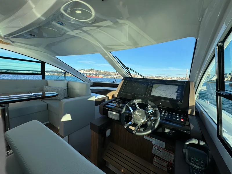 Slide: The Image of Interior helm of 2024 Cruisers Yachts 50 Cantius with panoramic views. - 17