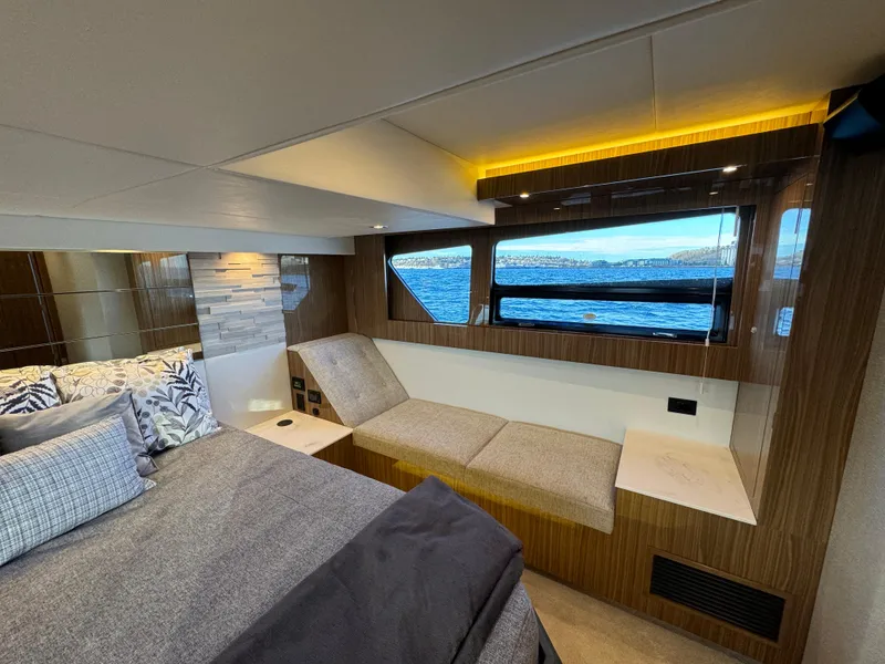Slide: The Image of Luxurious cabin interior of 2024 Cruisers Yachts 50 Cantius with scenic window view. - 24