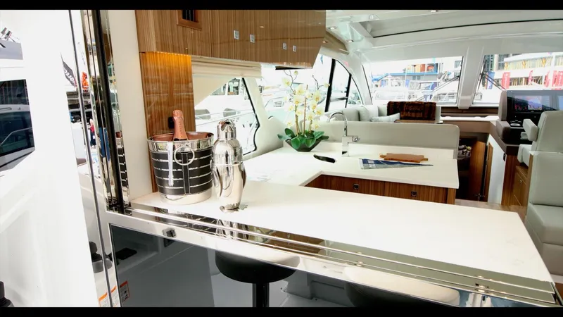 Slide: The Image of Luxurious interior of 2024 Cruisers Yachts 50 Cantius with modern decor and seating area. - 28