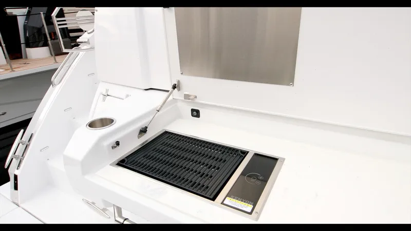 Slide: The Image of Outdoor grill station on 2024 Cruisers Yachts 50 Cantius. - 29