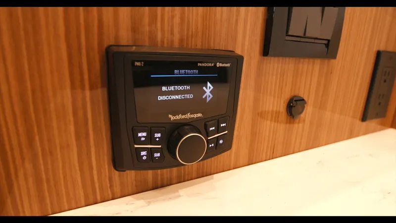 Slide: The Image of Rockford Fosgate Bluetooth stereo system in 2024 Cruisers Yachts 50 Cantius. - 49