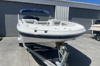 Slide: The Image of 2022 Hurricane SS 192RL boat on trailer in sunny outdoor setting. - 3