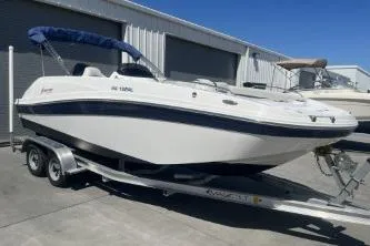 Slide: The Image of 2022 Hurricane SS 192RL boat on trailer, parked outside storage facility. - 4