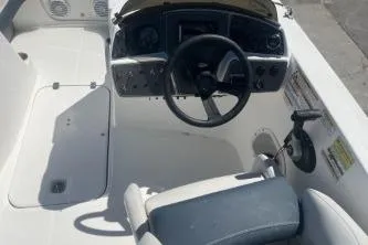Slide: The Image of 2022 Hurricane SS 192RL boat cockpit with steering wheel and control panel. - 8