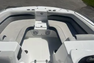 Slide: The Image of 2022 Hurricane SS 192RL boat interior with cushioned seating and storage compartments. - 9