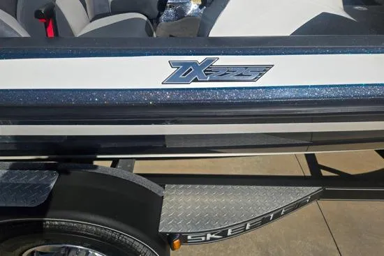 Slide: The Image of 2015 Skeeter ZX225 boat detail with logo and trailer. - 10