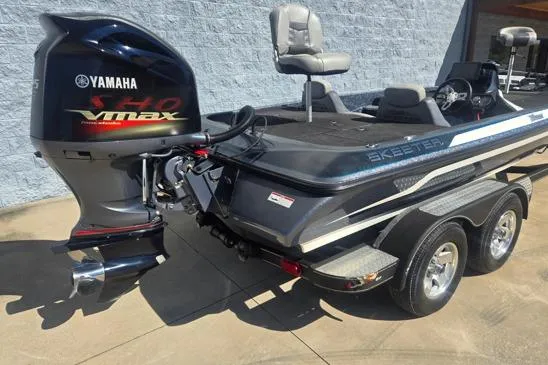 Slide: The Image of 2015 Skeeter ZX225 boat with Yamaha VMAX engine, parked on a trailer. - 11