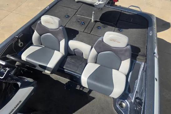 Slide: The Image of 2015 Skeeter ZX225 boat interior with dual seats and spacious deck layout. - 7
