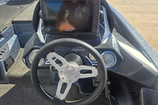 Slide: The Image of Steering console of a 2015 Skeeter ZX225 boat with Garmin display. - 8