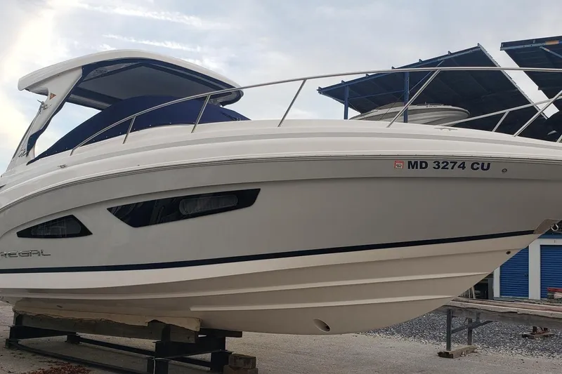 Slide: The Image of 2023 Regal 33 XO boat on display, featuring sleek design and modern features. - 3