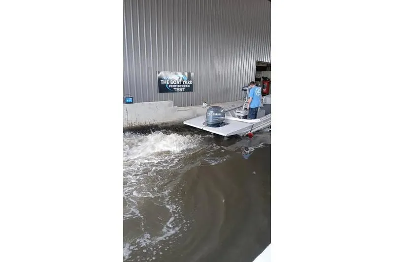 Slide: The Image of Boat undergoing performance test in indoor facility, Custom model 18, 1983. - 11