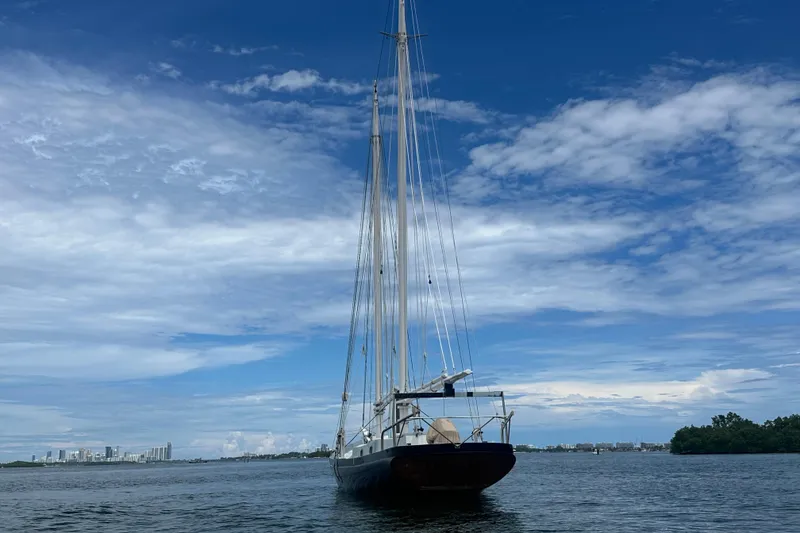 Slide: The Image of Schooner Leopard 1994 sailing on calm waters under a clear blue sky. - 15