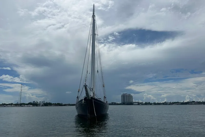 Slide: The Image of Schooner Leopard sailboat on calm water under cloudy sky, 1994 model. - 17