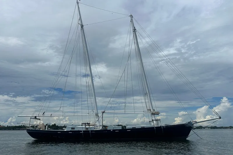 Slide: The Image of Schooner Leopard 1994 sailing vessel on calm waters under cloudy sky. - 18