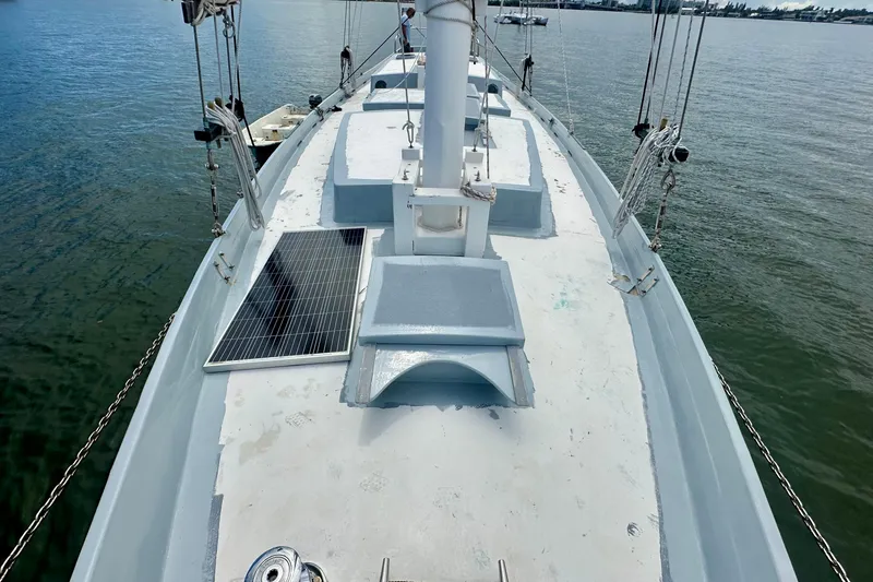 Slide: The Image of Deck view of 1994 Pilot Schooner Leopard with solar panel, sailing on calm waters. - 37