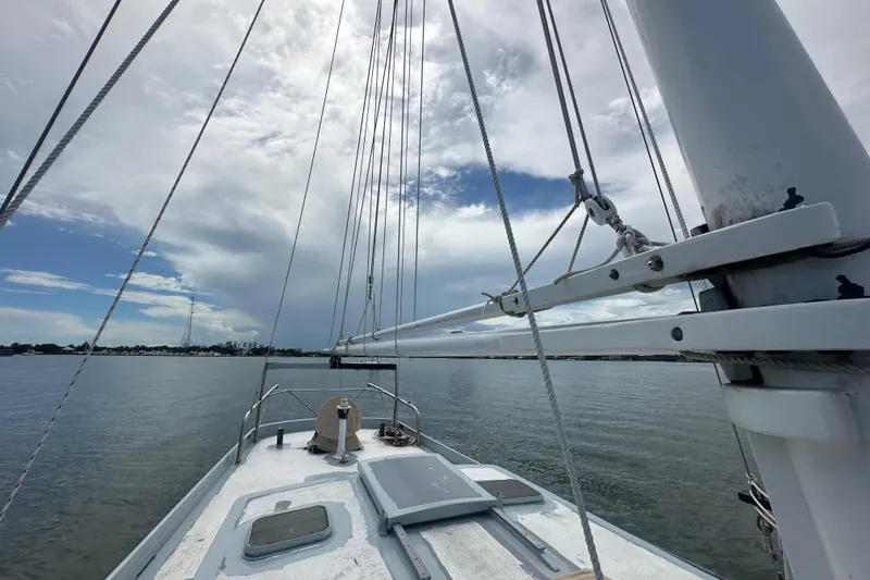 Slide: The Image of Schooner Leopard 1994 sailing on calm waters under a cloudy sky. - 42