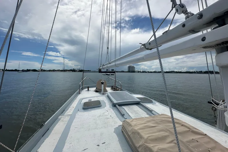 Slide: The Image of Schooner Leopard 1994 sailing on calm waters under a partly cloudy sky. - 43