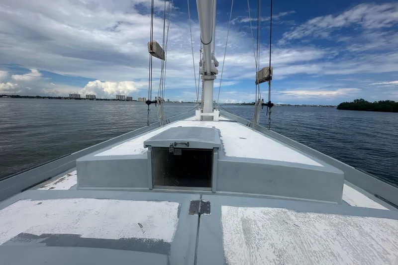 Slide: The Image of Schooner Leopard 1994 sailing on calm waters under a partly cloudy sky. - 46