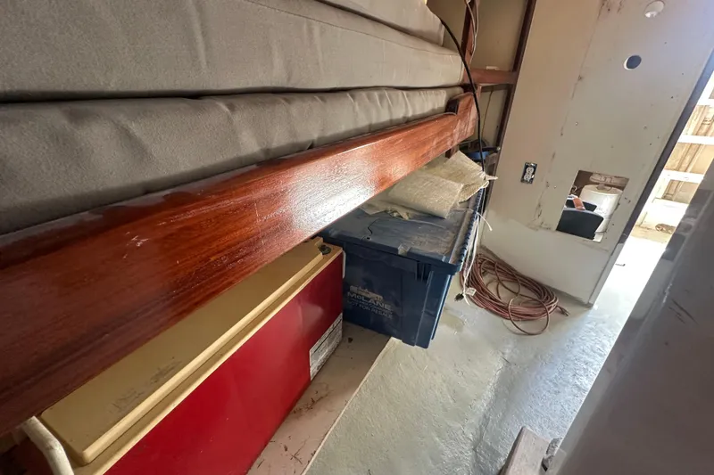 Slide: The Image of Interior view of 1994 Pilot Schooner Leopard with storage and wooden trim. - 59