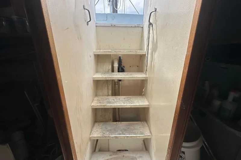 Slide: The Image of Staircase inside 1994 Pilot Schooner Leopard, leading to deck, with visible handrails. - 64