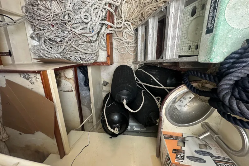 Slide: The Image of Interior of 1994 Pilot Schooner Leopard with ropes, fenders, and equipment. - 85