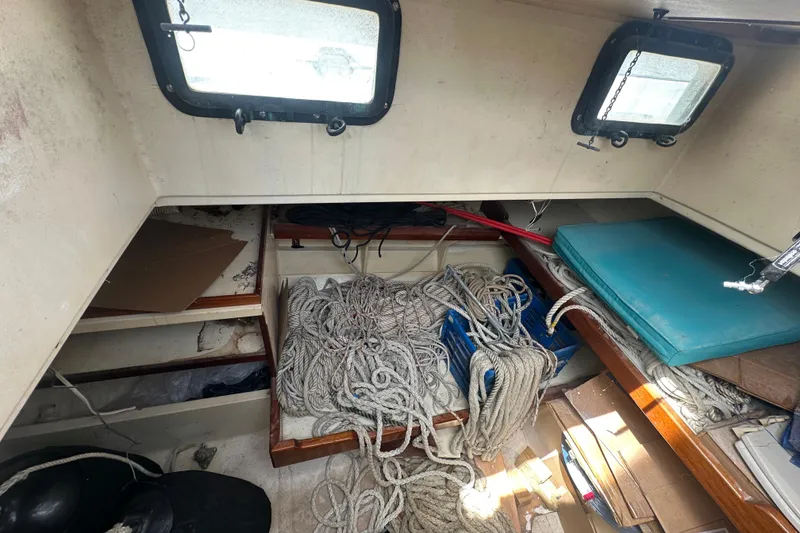 Slide: The Image of Interior of 1994 Pilot Schooner Leopard with ropes, storage, and windows. - 86
