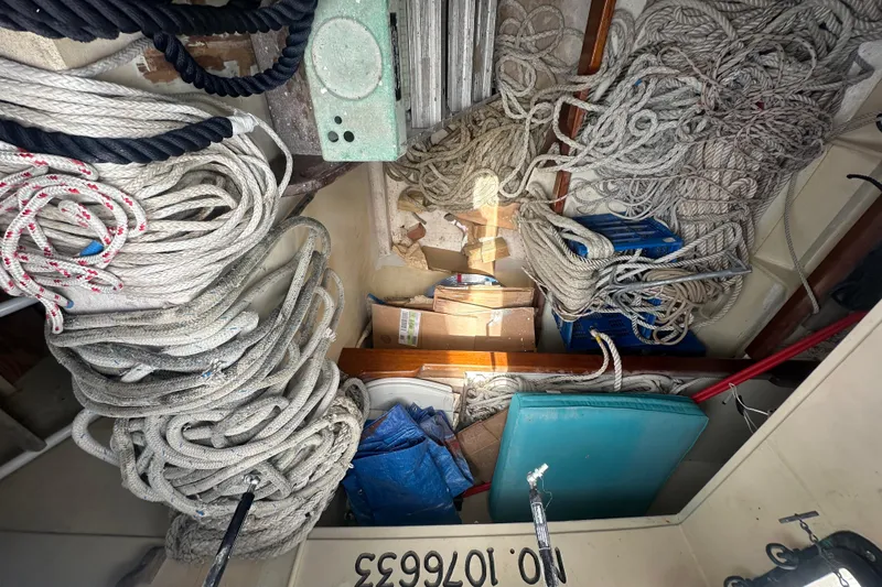 Slide: The Image of Tangled ropes and equipment inside 1994 Pilot Schooner Leopard boat storage area. - 87