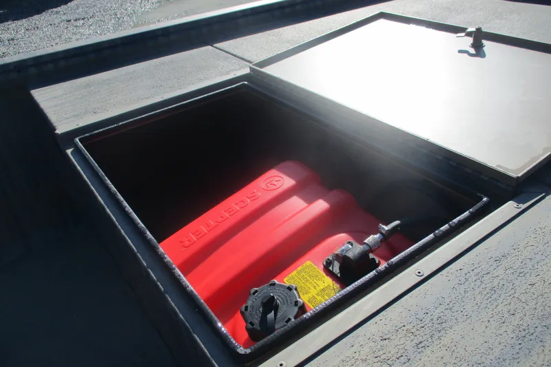 Slide: The Image of Open storage compartment of 2026 Gator Tail 1754 Extreme boat, revealing red fuel tank. - 9