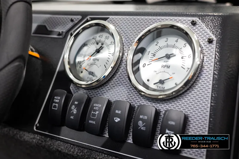 Slide: The Image of Dashboard of 2025 Lund Rebel XL SS boat with speedometer and RPM gauges. - 21