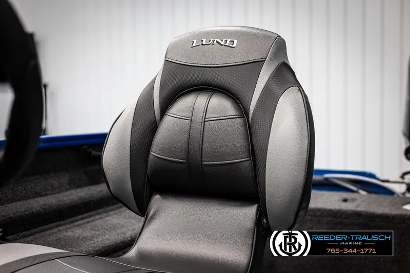 Slide: The Image of 2025 Lund Rebel XL SS boat seat, black and gray design, Reeder-Trausch Marine logo visible. - 23