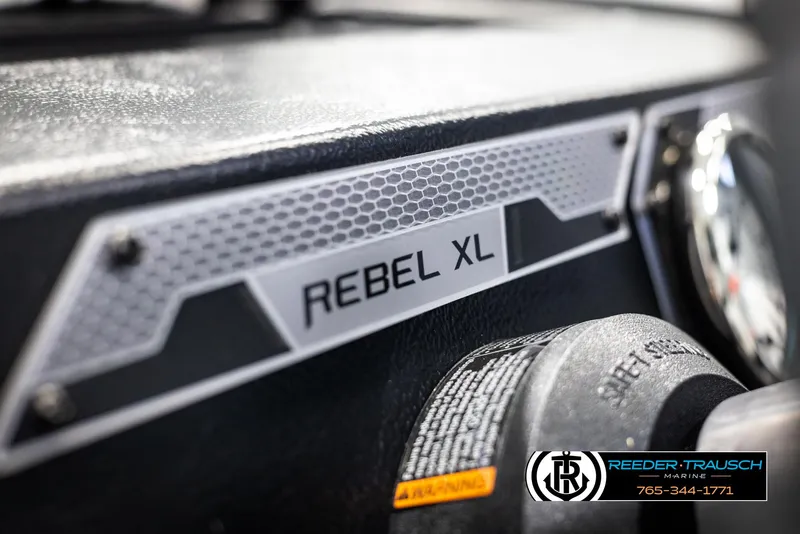 Slide: The Image of 2025 Lund Rebel XL SS dashboard close-up with Reeder-Trausch Marine branding. - 26