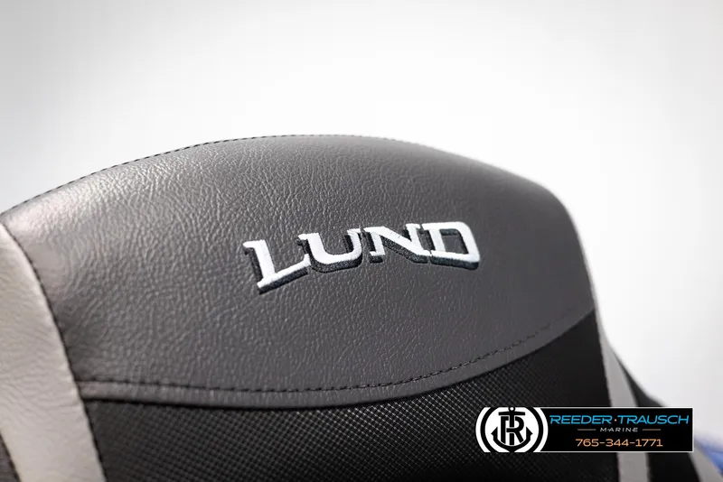 Slide: The Image of 2025 Lund Rebel XL SS boat seat with logo, featuring Reeder-Trausch Marine branding. - 27