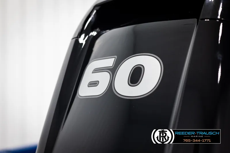 Slide: The Image of 2025 Lund Rebel XL SS boat engine with "60" decal, Reeder-Trausch Marine branding. - 32