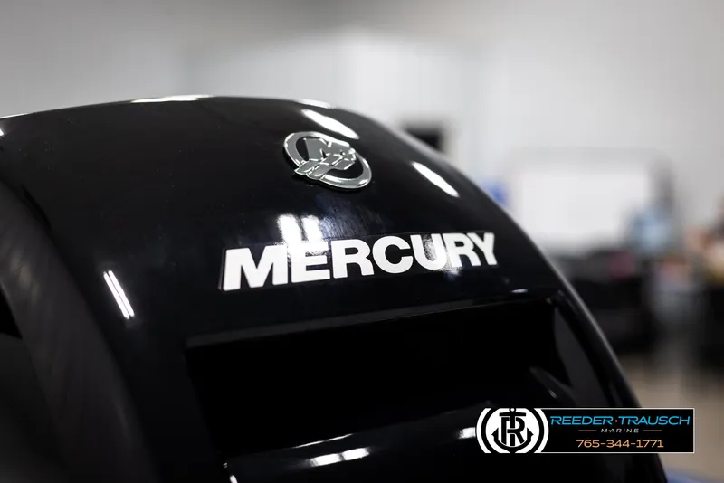 Slide: The Image of Mercury engine on 2025 Lund Rebel XL SS boat, Reeder-Trausch Marine logo visible. - 33