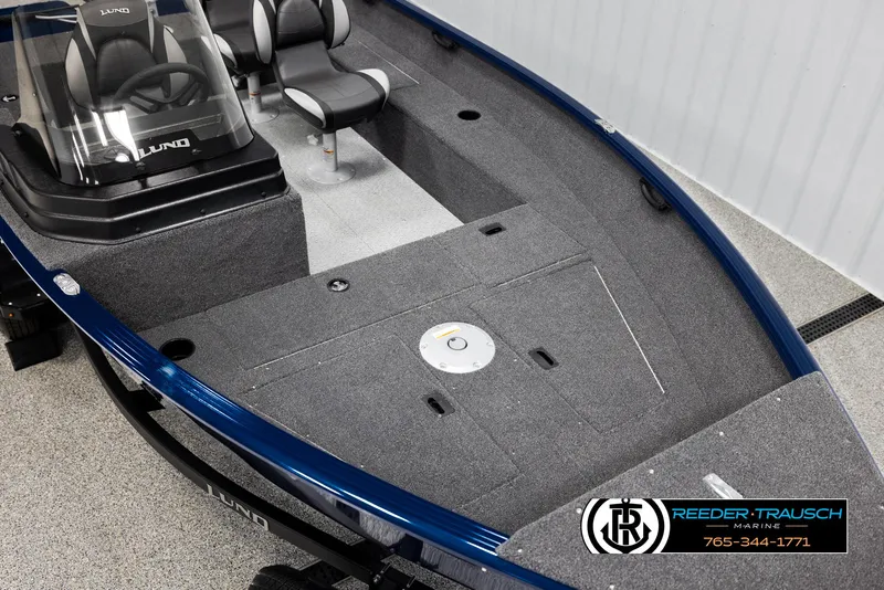 Slide: The Image of 2025 Lund Rebel XL SS boat interior with seating and storage compartments. - 7