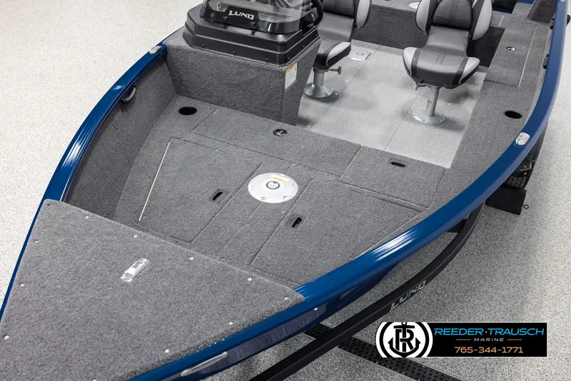 Slide: The Image of 2025 Lund Rebel XL SS boat interior with seating and storage compartments. - 8