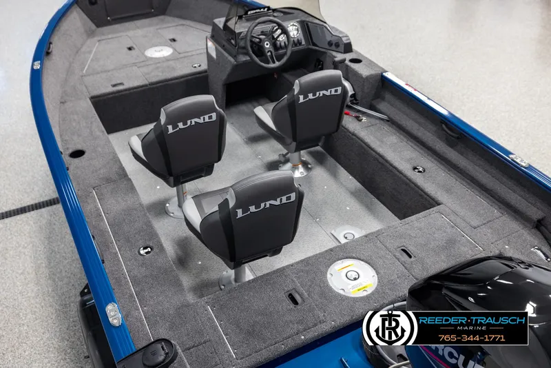 Slide: The Image of 2025 Lund Rebel XL SS boat interior with two seats and steering console. - 9