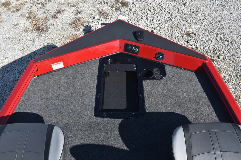 Slide: The Image of 2026 Lund 1875 Renegade boat interior with red trim and gray seating. - 11