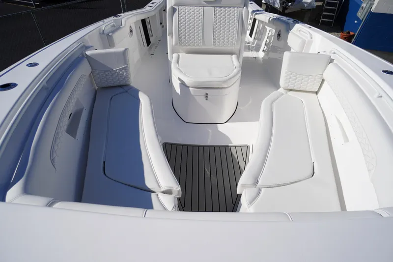 Slide: The Image of 2026 Tidewater 272 LXF boat interior with white seating and sleek design. - 10