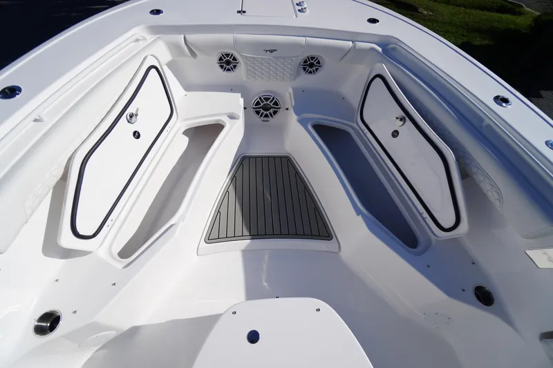 Slide: The Image of 2026 Tidewater 272 LXF boat interior with storage compartments and sleek design. - 13