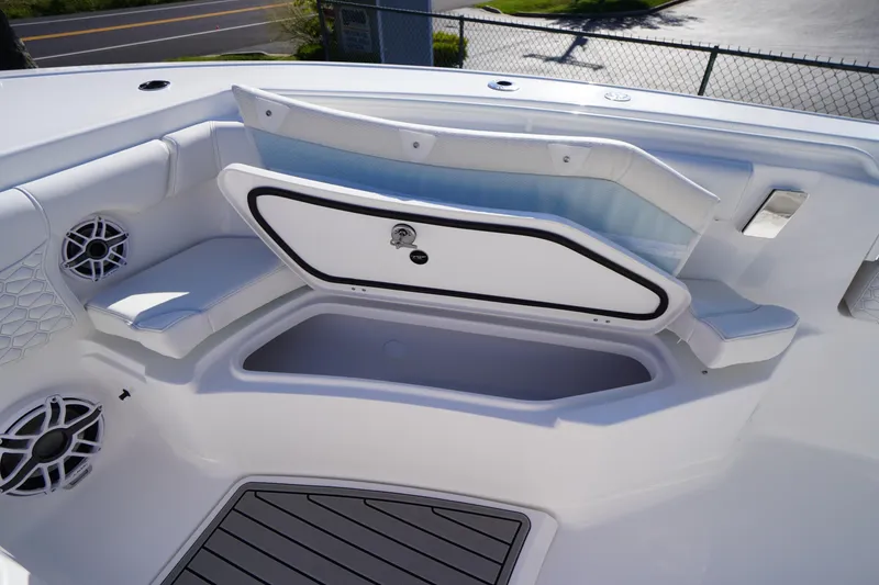 Slide: The Image of 2026 Tidewater 272 LXF boat interior with open storage compartment and seating. - 15